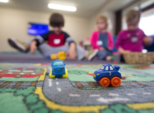 Children playing with toy cars at Evis Nursery in Maadi, Cairo, Egypt.